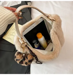 Close-up of fluffy faux fur tote bag with large capacity for tablets and daily items