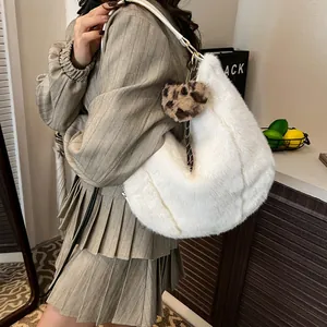 White faux fur hobo tote bag with leopard print pom-pom and striped ribbon detail