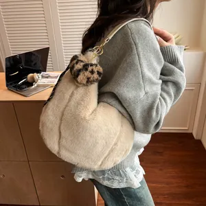 Winter plush tote bag in cream faux fur with leopard print charm and silk ribbon accent
