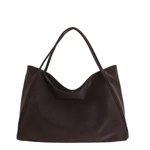 Minimalist large dark brown tote bag in matte leather with slim shoulder straps