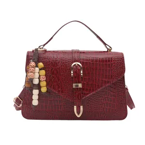 Retro burgundy faux crocodile leather satchel bag with beaded charm and top handle