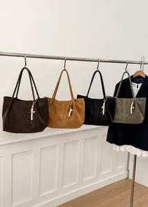 Detailed view of large tote bags in four colors with decorative beaded tassels