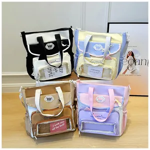 Detailed view of canvas tote bags in four color schemes with clear card display windows