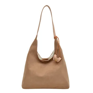 Vintage brown faux leather large tote bag with a wide strap and small hanging pouch