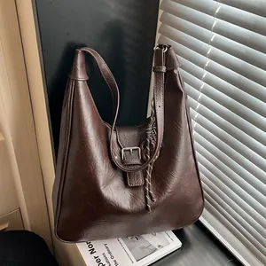 Vintage dark brown large capacity faux leather shoulder bag with buckle and woven tassel