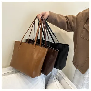 Detailed trio of chic tote bags in caramel, dark brown, and black with premium leather texture