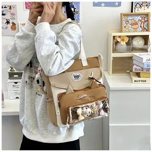 Detail of khaki tote bag featuring a cat-ear clear window and LinaBell plush display