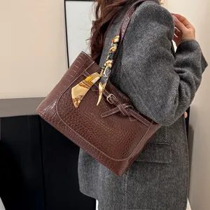 Brown crocodile embossed tote bag with decorative silk scarf for professional office wear