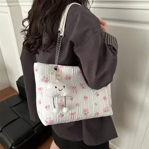 White floral bow tote bag with pink roses, silver chain strap and plush cloud charm