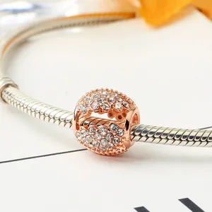 Hollow four-leaf clover rose gold charm bead with clear crystals on silver snake chain