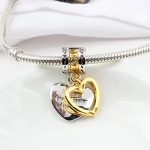 Two-tone heart charm on silver bracelet with engraving The dreams of life are seeds