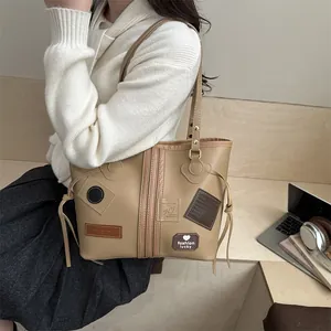 Vintage retro style khaki tote bag with fashion lucky patches and large capacity for daily use