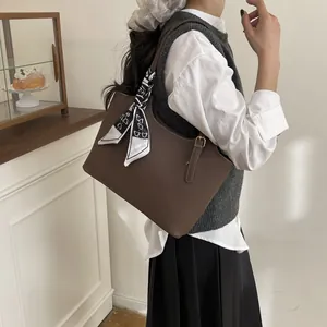 Brown lychee texture tote bag for women with a black and white printed silk scarf accessory