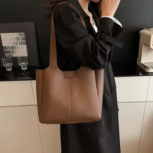 Brown vintage faux leather tote bag with vertical stitching for daily commute