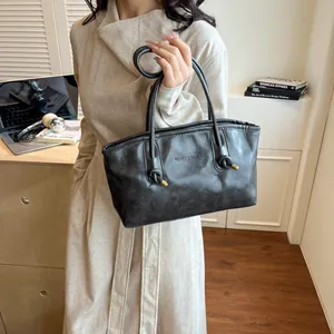 Retro large capacity black leather tote bag with knot strap and gold accents for women