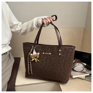 Large vintage leopard print tote bag in dark brown suede with stylish bear pendant charm