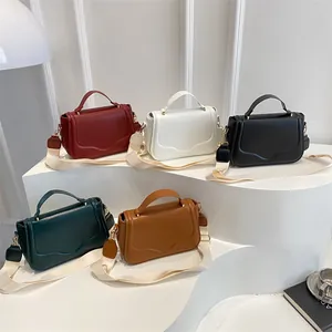 Chic textured crossbody bag in five colors with stylish wide woven strap and wave flap