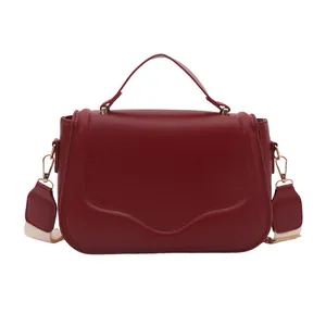 Deep red PU leather crossbody bag with wave-edge flap and striped wide strap