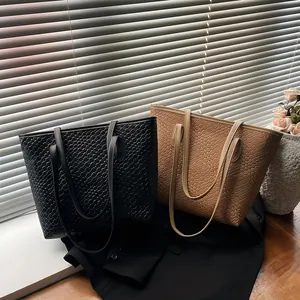 Woven leather tote bag in black and camel colors with large capacity shoulder design