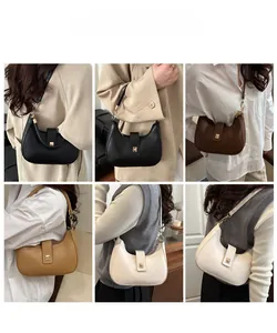 Detail view of retro half-moon bags in four colors showing the matte leather and metal buckle