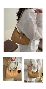 Detail of light brown crescent shoulder bag with golden square twist lock and matte finish