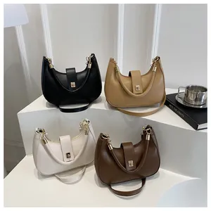 Detail view of crescent hobo bags in four colors with gold buckles and leather texture