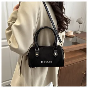 Chic black frosted Boston pillow bag with white lettering and gold-tone hardware