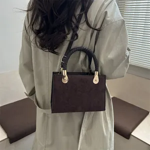Retro dark brown crossbody bag with clover embossing and woven handle for women