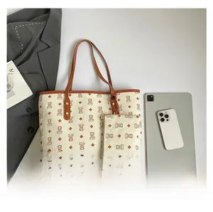 Detailed comparison showing large printed tote bag capacity with tablet and small pouch