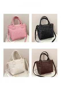 Detailed view of woven leather tote bags in pink black off-white and coffee colors