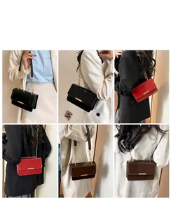 Detail shots of glossy leather mini square bag in black, red and brown with metal chain