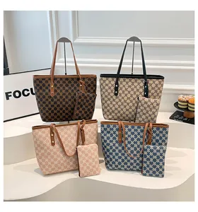 Macro display of tote bags in four colors with matching pouches and monogram pattern