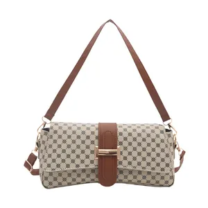 Retro monogrammed shoulder bag in cream canvas with brown leather straps and gold buckle
