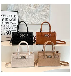 Collection of four crocodile pattern tote bags in black, brown, cream, and khaki colors