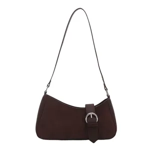 Dark brown suede underarm shoulder bag with decorative silver buckle and strap