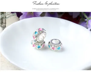 Macro shot of colorful enamel heart charms made of S925 silver metal for jewelry