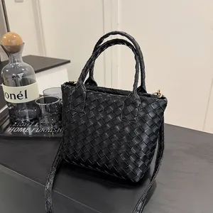 Classic black woven leather Boston bag with gold hardware and dual top handles