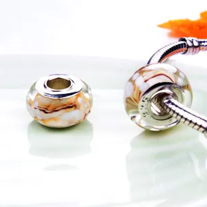 Orange and white Murano glass charm beads with 925 silver core on a snake chain