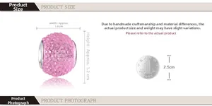 Pink resin crystal charm bead with dimension 1.0x1.2cm shown next to a coin for scale