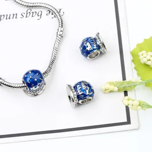 Silver snake chain bracelet with deep blue enamel star and moon charms and crystals