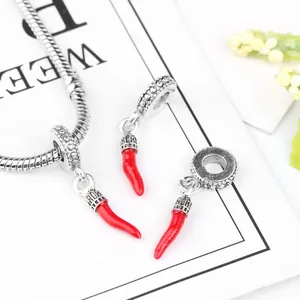 Red chili charm pendants in silver metal with cubic zirconia on a snake chain bracelet