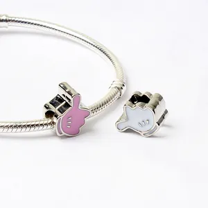 Silver snake chain bracelet with pink and white cartoon glove charms for DIY jewelry