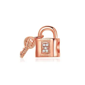 Detail of rose gold key and padlock charm with inlaid crystals and LOVE engraving
