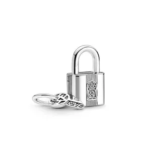 Silver padlock and key pendant with vertical stripes and LOVE engraving on white background