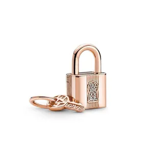 Rose gold key and padlock pendant with LOVE engraving and white zircon accents