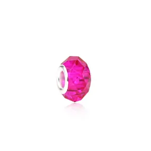 Macro shot of rose pink faceted glass bead with silver metal core for DIY bracelets
