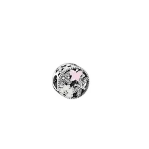 Detail of silver charm with pink enamel butterfly, flowers and dragonfly motifs