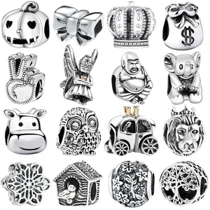 Detailed set of 16 vintage silver charms including crown, owl, and tree of life motifs