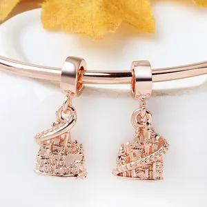 Macro view of rose gold fairy tale castle charms with intricate embossed tower details