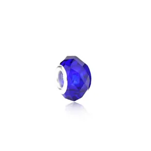 Close-up of faceted deep blue crystal charm bead with silver core for DIY bracelets